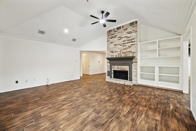 12514 Wealdstone Dr, Tomball, TX 77377 - unfurnished living room with vaulted ceiling, wood finished floors, ceiling fan, a brick fireplace, and crown molding