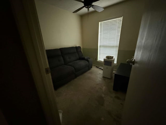 living area with ceiling fan