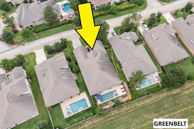 aerial view of residential area featuring a pool area
