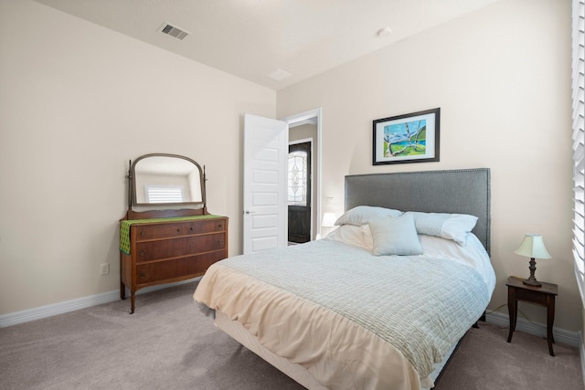 carpeted bedroom with baseboards