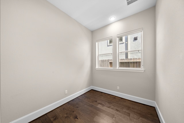 1404 Arkley Way, Houston, TX 77055 - spare room featuring baseboards and dark wood-style floors