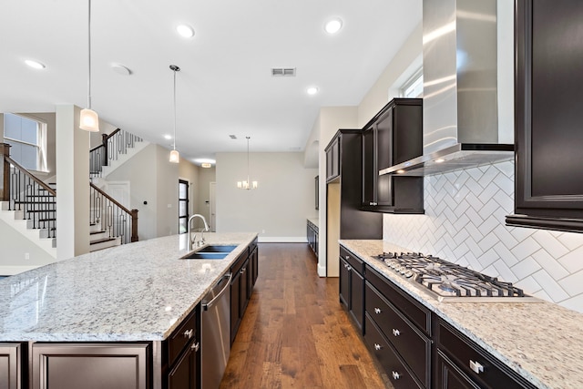 1404 Arkley Way, Houston, TX 77055 - kitchen with wall chimney range hood, a sink, appliances with stainless steel finishes, decorative backsplash, and dark wood-style flooring
