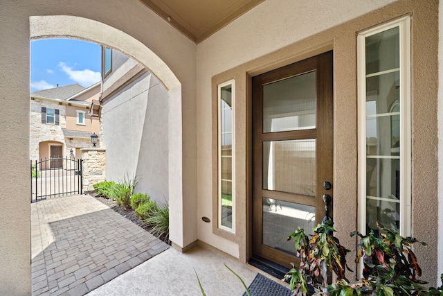 1404 Arkley Way, Houston, TX 77055 - property entrance with a gate, stucco siding, and stone siding