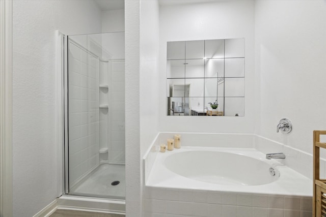 21022 Solstice Point Dr, Hockley, TX 77447 - full bathroom featuring a shower stall and a garden tub