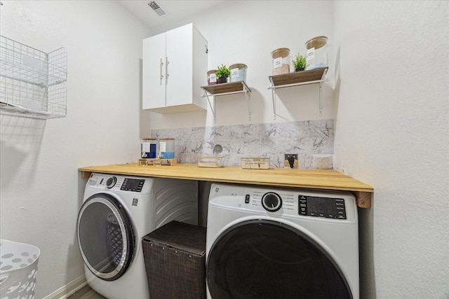 21022 Solstice Point Dr, Hockley, TX 77447 - laundry area with washing machine and clothes dryer, cabinet space, and baseboards