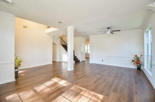 18106 Rileybrook Cir, Houston, TX 77094 - unfurnished living room with a ceiling fan, wood finished floors, stairway, crown molding, and baseboards