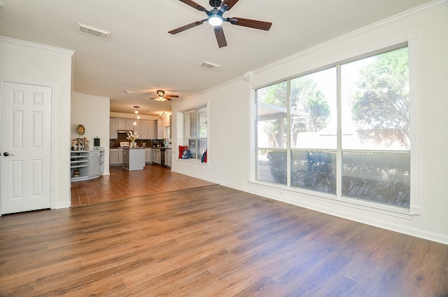 18106 Rileybrook Cir, Houston, TX 77094 - unfurnished living room with a ceiling fan, crown molding, dark wood-style flooring, and baseboards