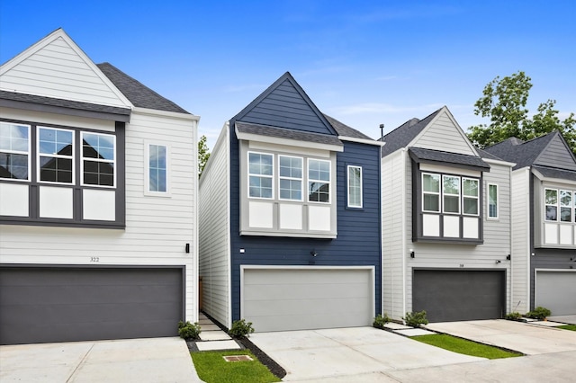 322 Neyland St, Houston, TX 77022 - view of front of house with a garage and driveway