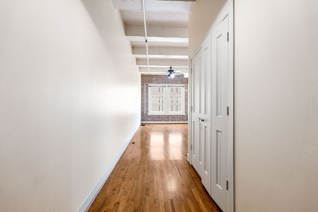 1120 Texas St Unit 7D, Houston, TX 77002 - hallway featuring wood finished floors and baseboards