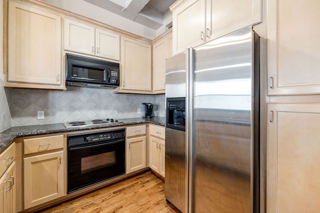 1120 Texas St Unit 7D, Houston, TX 77002 - kitchen featuring black appliances, light wood-style flooring, decorative backsplash, dark stone counters, and light brown cabinetry