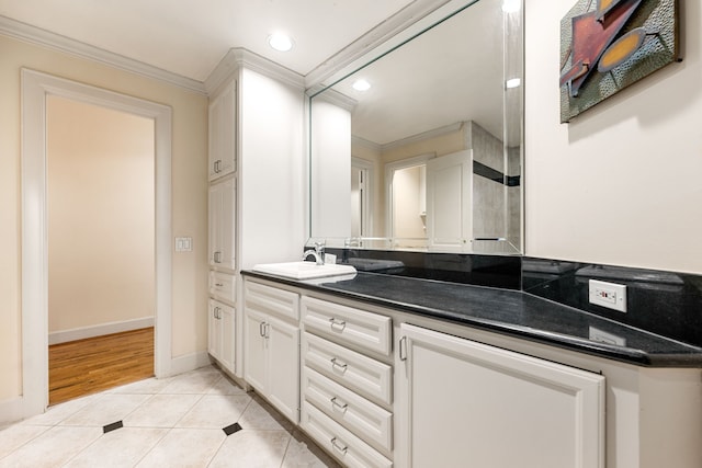 1120 Texas St Unit 7D, Houston, TX 77002 - bathroom with ornamental molding, tile patterned floors, vanity, recessed lighting, and baseboards