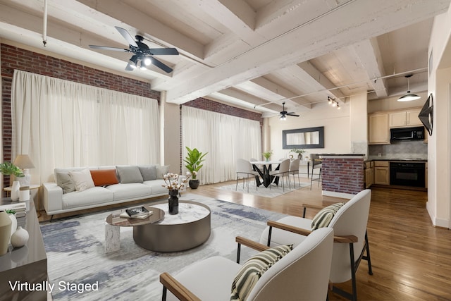 1120 Texas St Unit 7D, Houston, TX 77002 - living area with a ceiling fan, wood-type flooring, and beamed ceiling