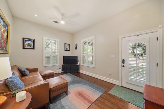 1710 Spring St, Houston, TX 77007 - living area with healthy amount of natural light, wood finished floors, ceiling fan, and baseboards
