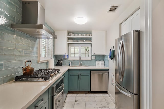 1710 Spring St, Houston, TX 77007 - kitchen with appliances with stainless steel finishes, a sink, wall chimney range hood, light marble finish floors, and white cabinets