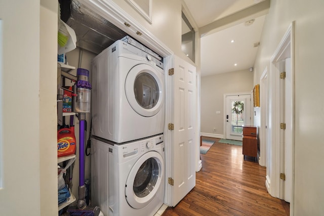 1710 Spring St, Houston, TX 77007 - laundry area featuring stacked washer / drying machine, wood finished floors, baseboards, and recessed lighting