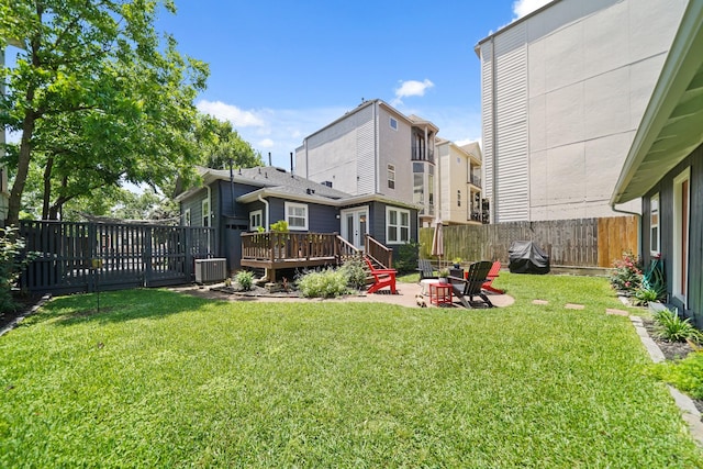 1710 Spring St, Houston, TX 77007 - view of yard with central AC unit and a wooden deck