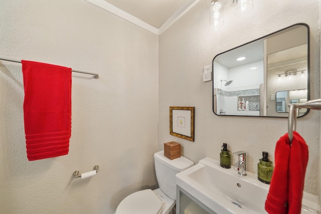 1710 Spring St, Houston, TX 77007 - bathroom with crown molding, toilet, and a sink