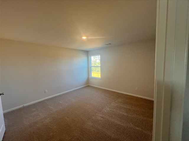 16457 Blossom Grove Dr, Conroe, TX 77303 - spare room with baseboards and carpet flooring