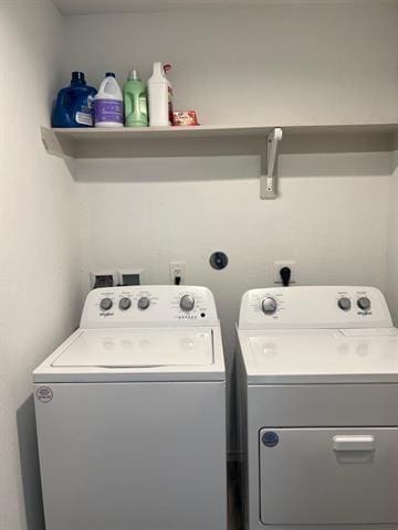 laundry area with independent washer and dryer
