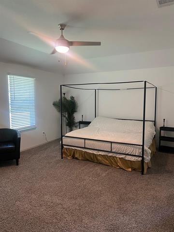 carpeted bedroom featuring ceiling fan