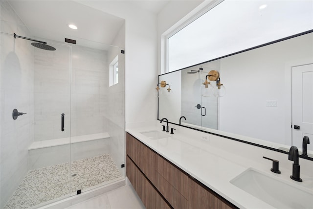 full bath with a shower stall, double vanity, tile patterned flooring, and recessed lighting