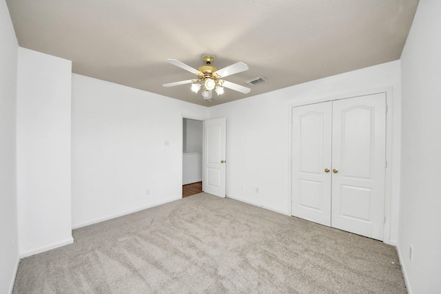 13114 Oak Ledge Dr, Houston, TX 77065 - unfurnished bedroom featuring carpet flooring, a closet, a ceiling fan, and baseboards