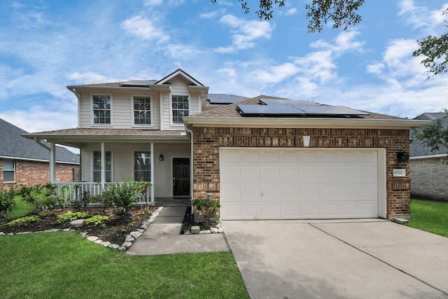 13114 Oak Ledge Dr, Houston, TX 77065 - traditional-style house featuring a porch, brick siding, driveway, solar panels, and an attached garage