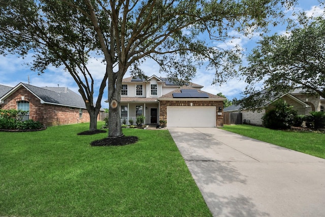 13114 Oak Ledge Dr, Houston, TX 77065 - traditional home featuring solar panels, driveway, brick siding, an attached garage, and a porch