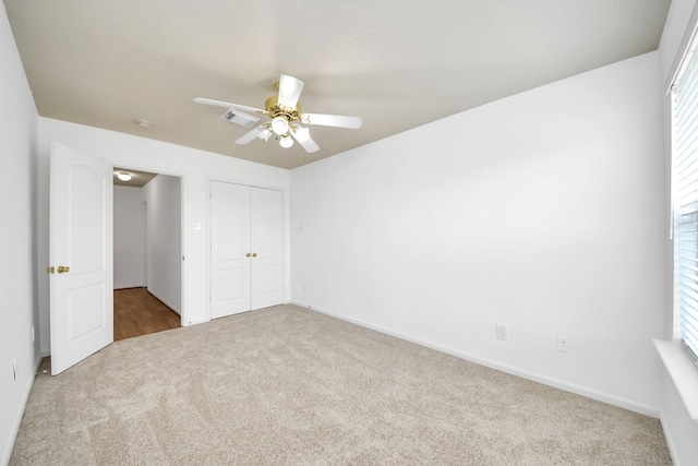 13114 Oak Ledge Dr, Houston, TX 77065 - unfurnished bedroom with carpet floors, a closet, a ceiling fan, and baseboards