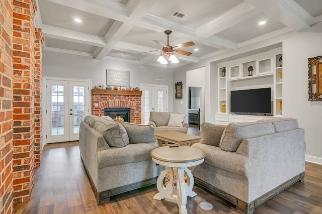 living room featuring french doors, a fireplace, beam ceiling, dark wood-style floors, and coffered ceiling