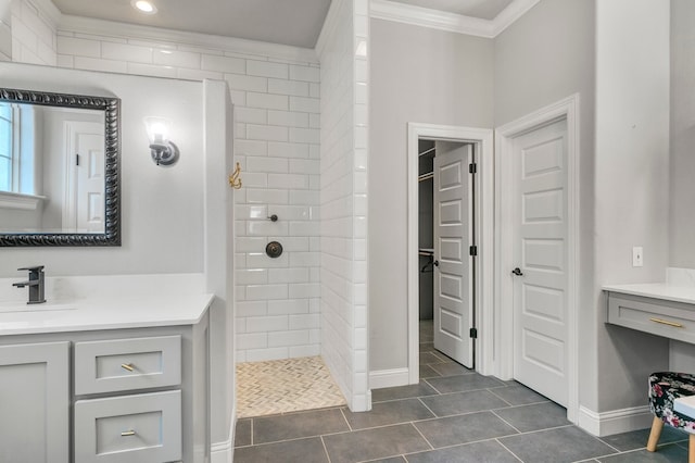 full bathroom featuring crown molding, walk in shower, vanity, tile patterned flooring, and baseboards