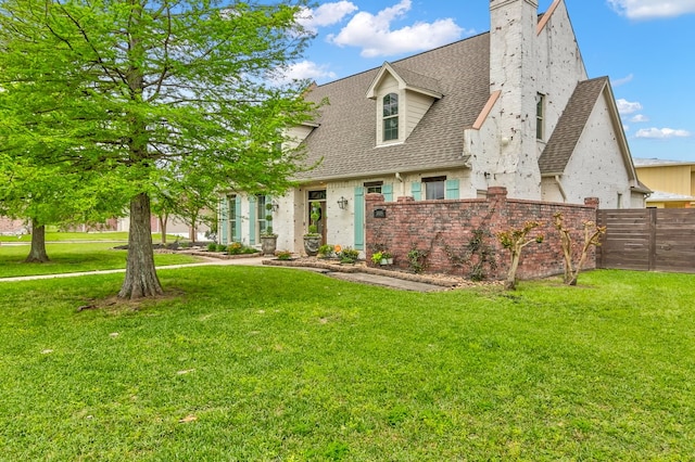 view of front of property with roof with shingles and a chimney