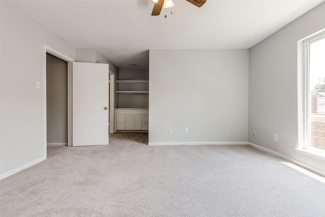 10816 Briar Forest Dr Unit 33, Houston, TX 77042 - unfurnished bedroom featuring carpet, baseboards, and a ceiling fan