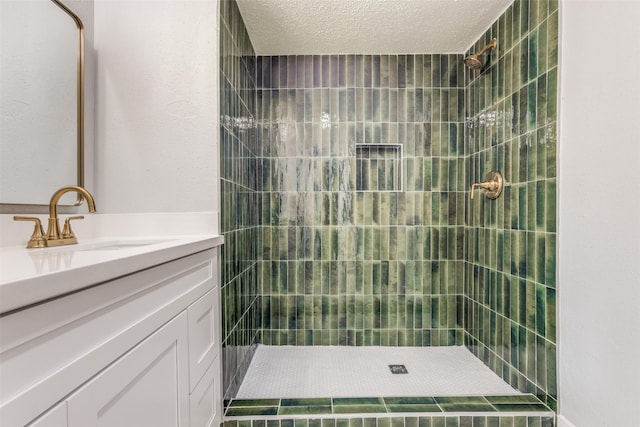 10816 Briar Forest Dr Unit 33, Houston, TX 77042 - full bath featuring vanity, a tile shower, and a textured ceiling