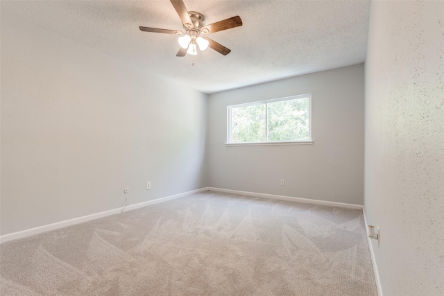 10816 Briar Forest Dr Unit 33, Houston, TX 77042 - empty room featuring a textured ceiling, carpet flooring, a ceiling fan, and baseboards