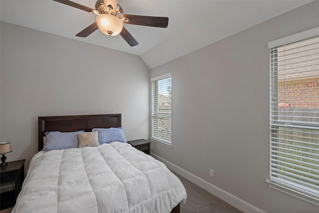 bedroom with baseboards, carpet flooring, ceiling fan, and vaulted ceiling