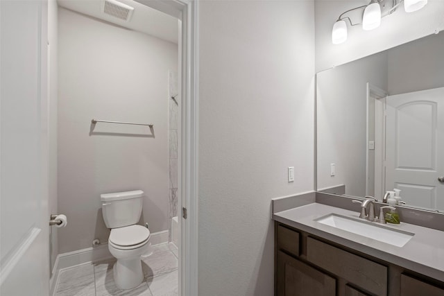 full bathroom with toilet, vanity, and baseboards