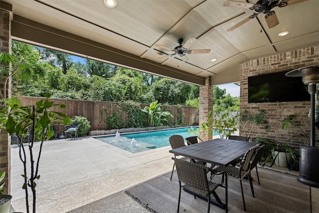 view of patio / terrace featuring a ceiling fan, a fenced backyard, and outdoor dining space