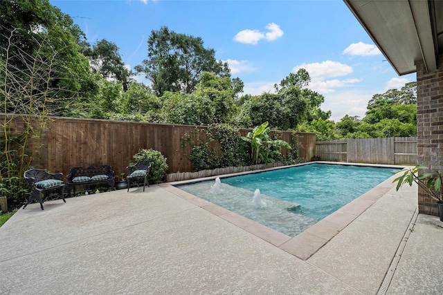 view of pool featuring a patio and a fenced backyard
