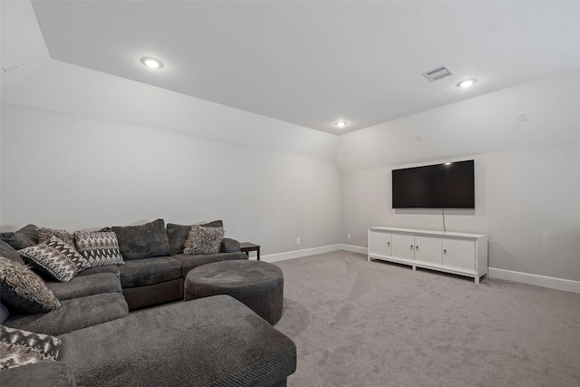 carpeted living room with baseboards, vaulted ceiling, and recessed lighting
