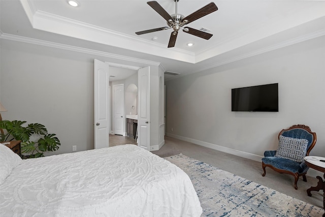 bedroom featuring a tray ceiling, ornamental molding, baseboards, light colored carpet, and recessed lighting