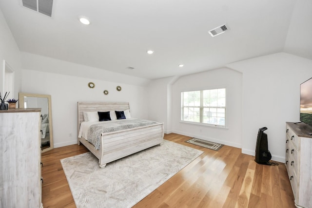 2003 Ballesteros St, Crosby, TX 77532 - bedroom featuring light wood-style flooring, lofted ceiling, baseboards, and recessed lighting