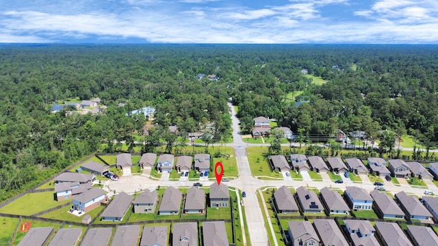2003 Ballesteros St, Crosby, TX 77532 - aerial overview of property's location featuring a forest and nearby suburban area