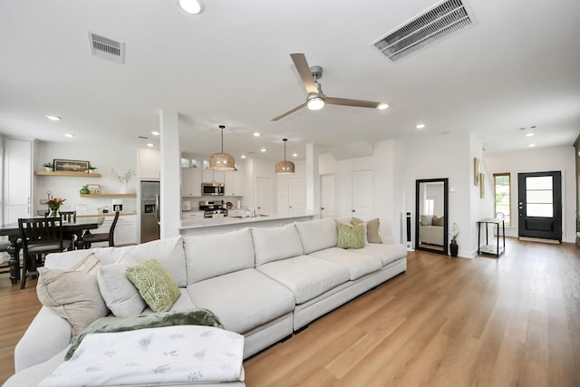 2003 Ballesteros St, Crosby, TX 77532 - living area with recessed lighting, light wood-type flooring, and a ceiling fan