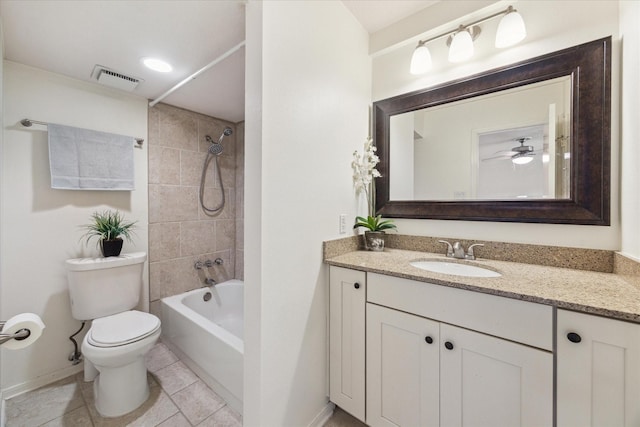 bathroom with baseboards, toilet, vanity, shower / tub combination, and tile patterned floors