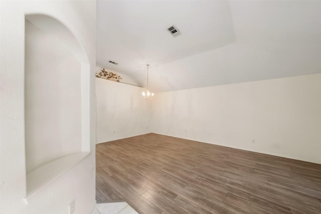 17922 Cypress Valley Ln, Cypress, TX 77429 - unfurnished room featuring wood finished floors, vaulted ceiling, and a chandelier