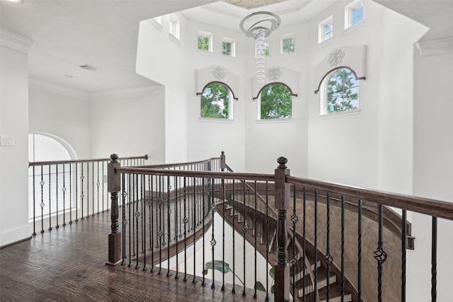 3109 Mcculloch Cir, Houston, TX 77056 - hallway with an upstairs landing, crown molding, a towering ceiling, and baseboards