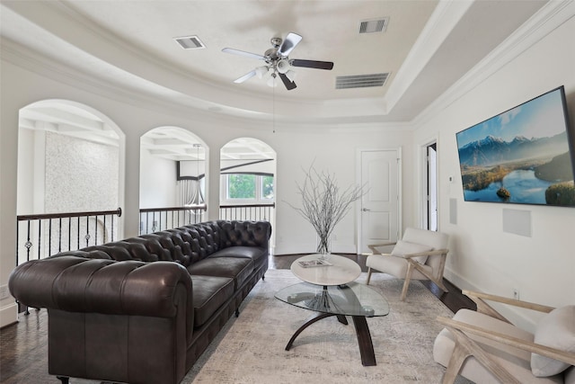 3109 Mcculloch Cir, Houston, TX 77056 - living area with a ceiling fan, wood finished floors, ornamental molding, a raised ceiling, and baseboards