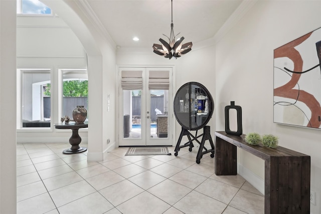 3109 Mcculloch Cir, Houston, TX 77056 - entrance foyer with ornamental molding, french doors, baseboards, arched walkways, and a chandelier