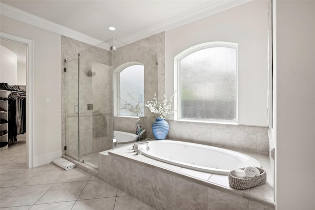 3109 Mcculloch Cir, Houston, TX 77056 - bathroom featuring a shower stall, a tub with jets, a walk in closet, tile patterned floors, and crown molding